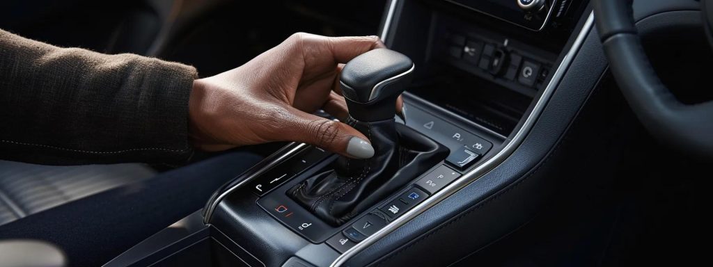 a close-up of a hand gripping a manual gear stick, highlighting the transition from automatic to manual driving with emphasis on control and efficiency.